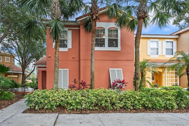 3015 Yellow Lantana Ln, Kissimmee, FL 34747 - view of property exterior with stucco siding and a tile roof