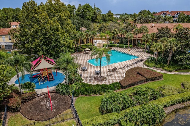 3015 Yellow Lantana Ln, Kissimmee, FL 34747 - community pool featuring fence and a patio area