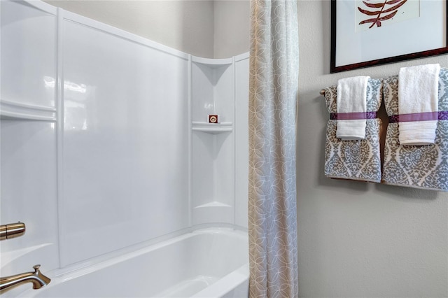 bathroom with shower / bath combination with curtain