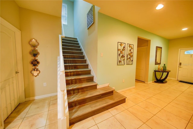 2147 Tripoli Ct, Kissimmee, FL 34747 - entrance foyer featuring stairs, light tile patterned flooring, recessed lighting, and baseboards