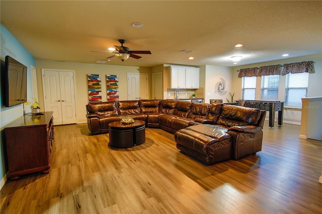 2147 Tripoli Ct, Kissimmee, FL 34747 - living area featuring light wood-type flooring, ceiling fan, baseboards, and recessed lighting
