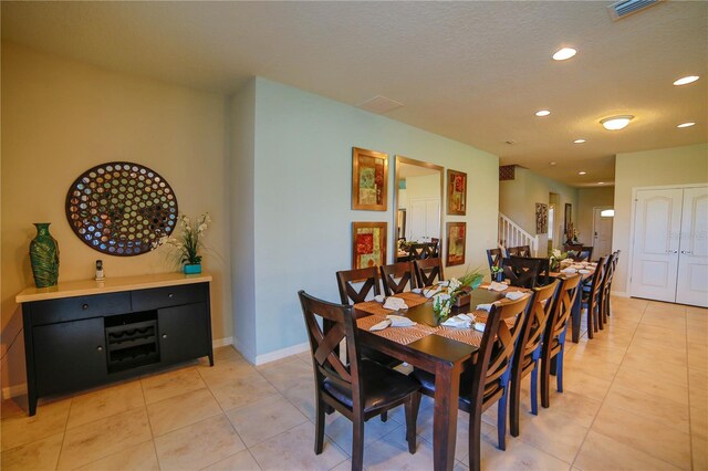 2147 Tripoli Ct, Kissimmee, FL 34747 - dining room with stairs, recessed lighting, light tile patterned floors, and baseboards
