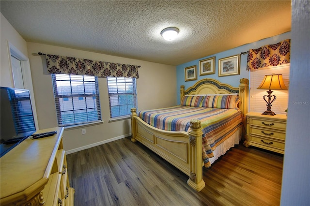 2147 Tripoli Ct, Kissimmee, FL 34747 - bedroom featuring dark wood finished floors, a textured ceiling, and baseboards