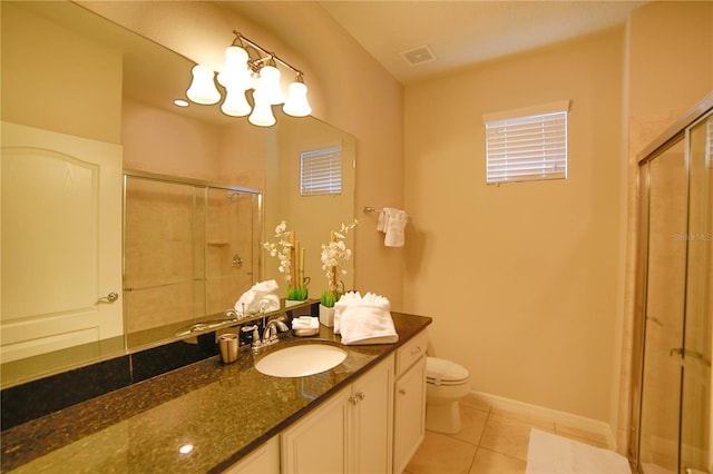 2147 Tripoli Ct, Kissimmee, FL 34747 - bathroom featuring a stall shower, tile patterned floors, toilet, and vanity