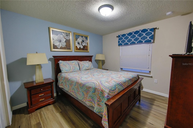 2147 Tripoli Ct, Kissimmee, FL 34747 - bedroom with wood finished floors, a textured ceiling, and baseboards