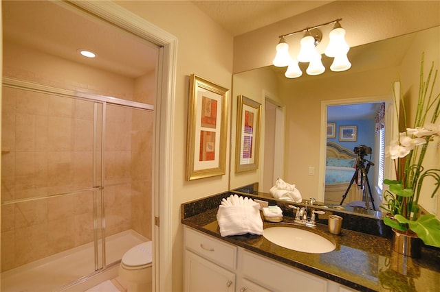 2147 Tripoli Ct, Kissimmee, FL 34747 - bathroom featuring a stall shower, a chandelier, toilet, and vanity