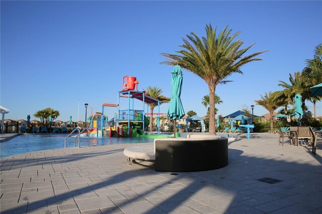 2147 Tripoli Ct, Kissimmee, FL 34747 - view of play area with a water play area and a community pool