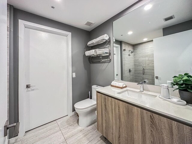 3900 Biscayne Blvd Unit N819, Miami, FL 33137 - full bathroom featuring a stall shower, toilet, recessed lighting, and vanity