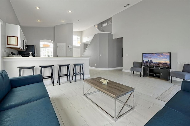 553 Bailey Cir, Davenport, FL 33897 - living room featuring recessed lighting and a towering ceiling
