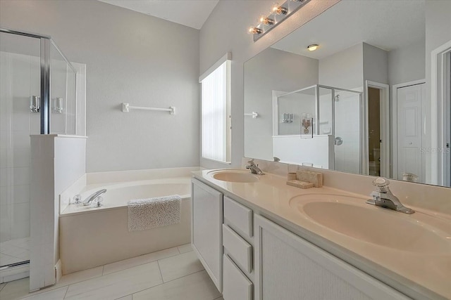553 Bailey Cir, Davenport, FL 33897 - bathroom featuring a shower stall, a bath, double vanity, and tile patterned flooring