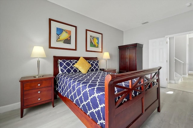 553 Bailey Cir, Davenport, FL 33897 - bedroom featuring light wood-style floors and baseboards