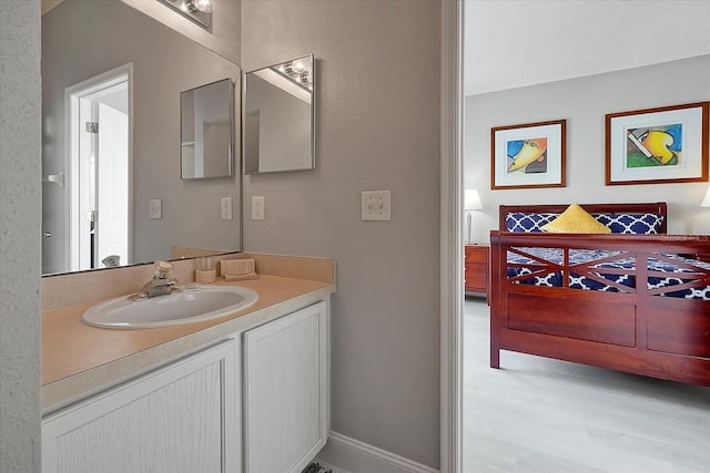 553 Bailey Cir, Davenport, FL 33897 - bathroom featuring vanity and wood finished floors