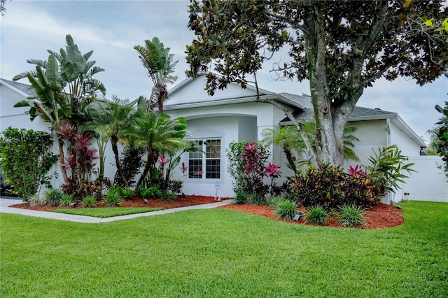 2341 Stone Cross Cir, Orlando, FL 32828 - view of front of home featuring a front lawn and stucco siding
