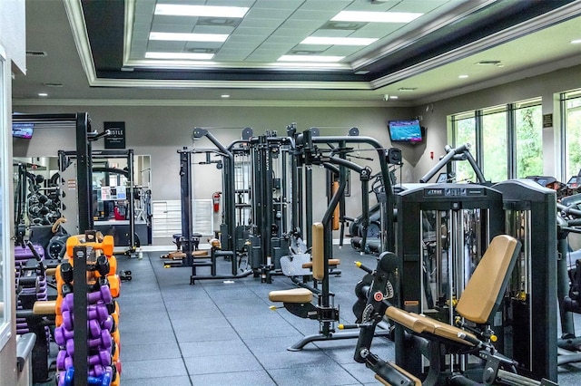 2341 Stone Cross Cir, Orlando, FL 32828 - gym with crown molding and a tray ceiling