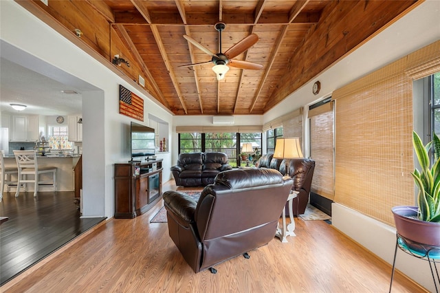 living room featuring wooden ceiling, light wood finished floors, ceiling fan, and vaulted ceiling