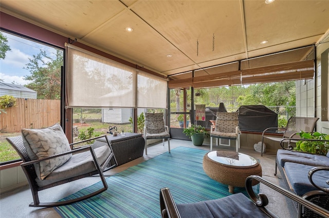 sunroom featuring plenty of natural light and outdoor lounge area
