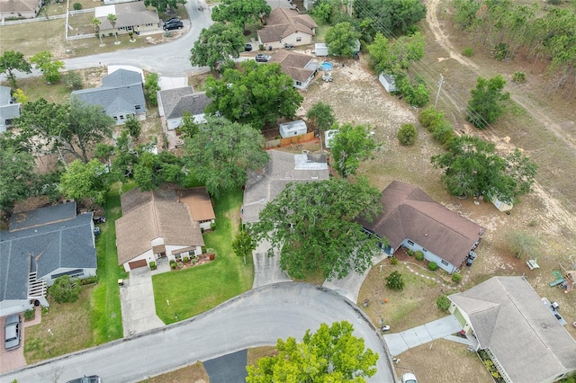 aerial view of property and surrounding area with nearby suburban area