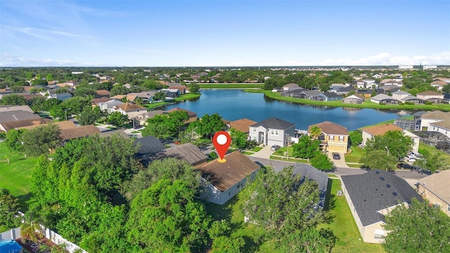 aerial view of residential area with a large body of water