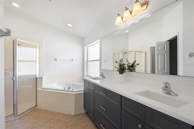 full bath featuring a garden tub, a shower stall, tile patterned floors, double vanity, and lofted ceiling