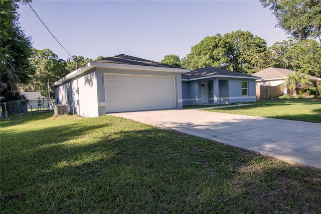 ranch-style house featuring cooling unit, stucco siding, driveway, and a garage