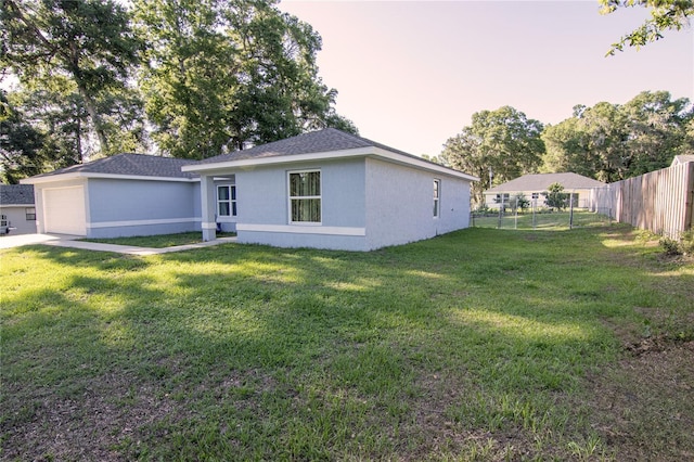 view of front of property with a garage and stucco siding