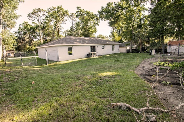 rear view of property with a gate