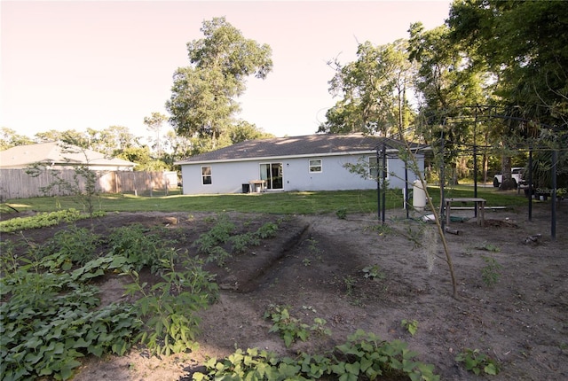 back of property featuring stucco siding