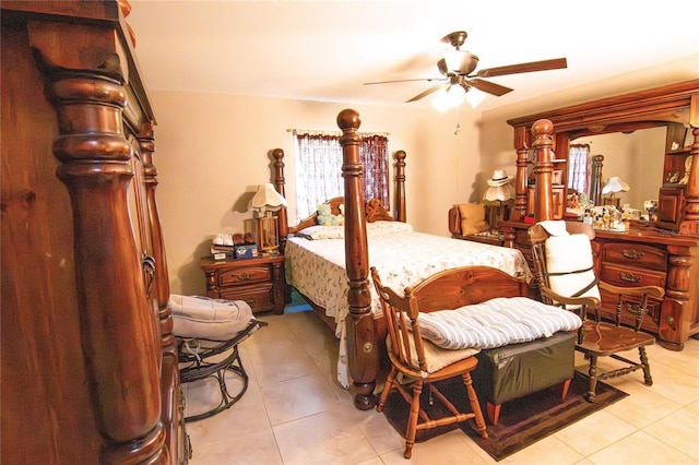 bedroom with light tile patterned flooring, multiple windows, and a ceiling fan
