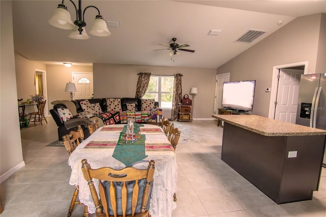 living area with light tile patterned floors, lofted ceiling, a ceiling fan, and baseboards