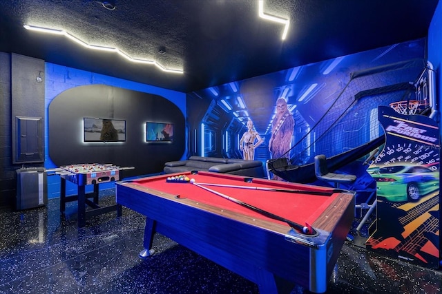 9020 Stinger Dr, Davenport, FL 33896 - playroom with billiards table and a textured ceiling