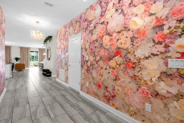 9020 Stinger Dr, Davenport, FL 33896 - corridor with a chandelier, baseboards, and wallpapered walls