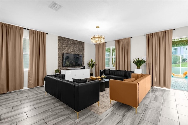 9020 Stinger Dr, Davenport, FL 33896 - living room featuring a chandelier, healthy amount of natural light, and wood tiled floors