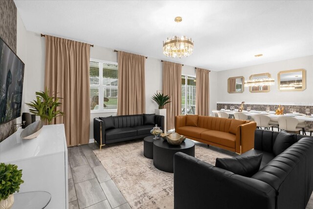 9020 Stinger Dr, Davenport, FL 33896 - living room featuring a chandelier and plenty of natural light