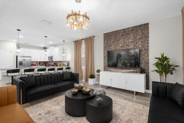9020 Stinger Dr, Davenport, FL 33896 - living area with recessed lighting, light wood-style flooring, a chandelier, and baseboards