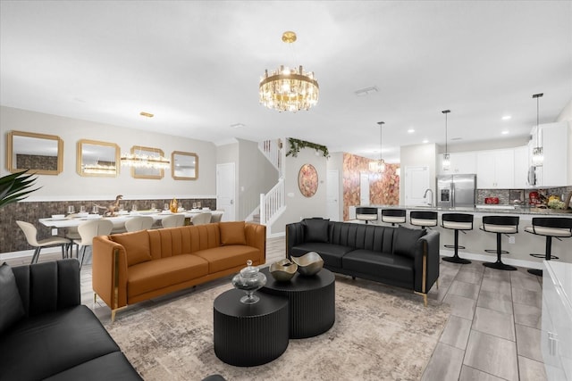9020 Stinger Dr, Davenport, FL 33896 - living area featuring stairs, a chandelier, and recessed lighting
