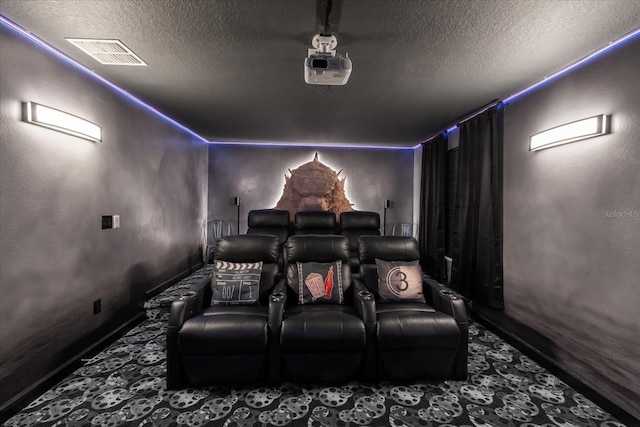 9020 Stinger Dr, Davenport, FL 33896 - home theater room featuring a textured ceiling, baseboards, and carpet floors