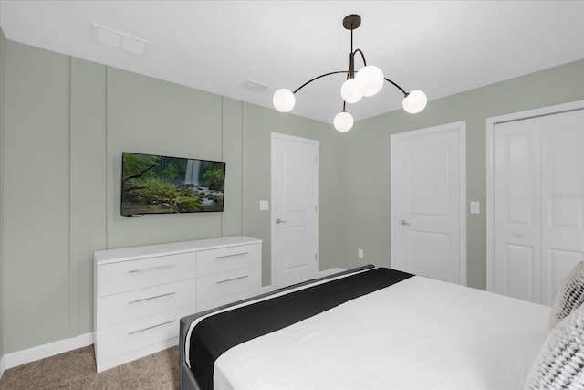 9020 Stinger Dr, Davenport, FL 33896 - carpeted bedroom featuring a chandelier and baseboards