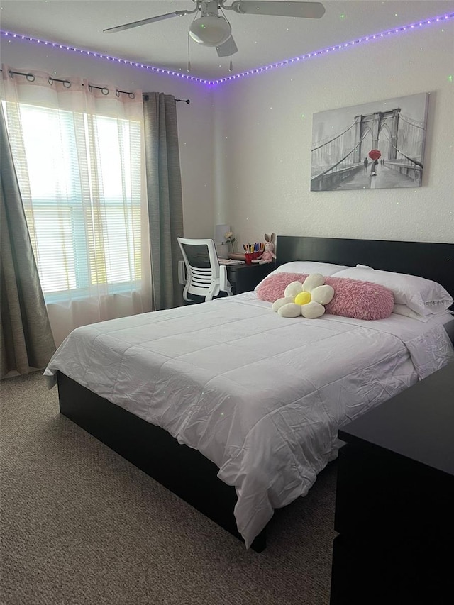 2203 San Vittorino Cir Unit 103, Kissimmee, FL 34741 - bedroom with carpet floors and ceiling fan