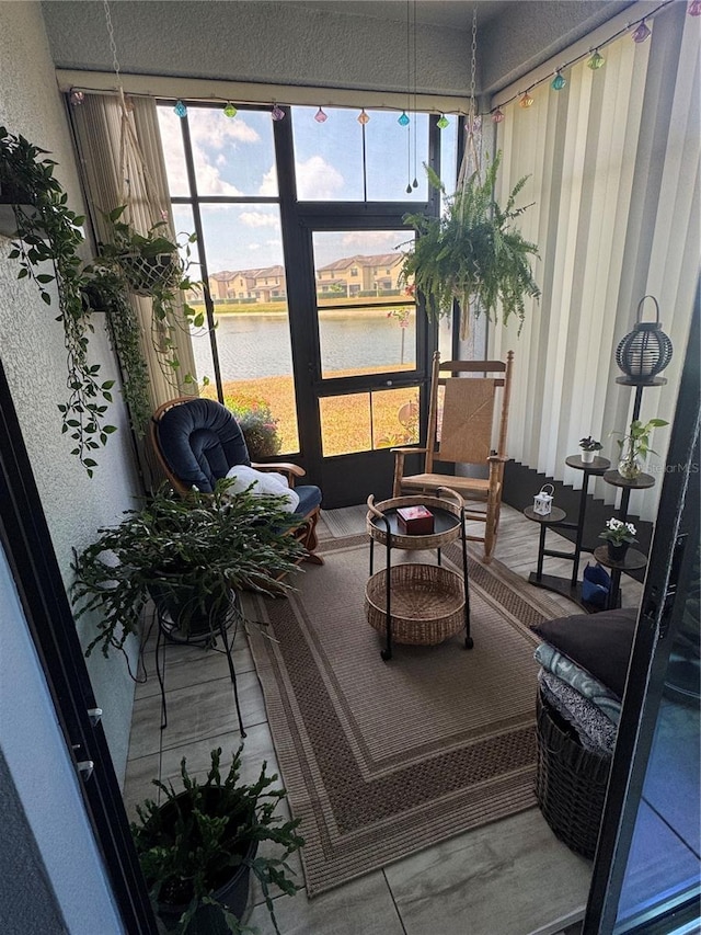 2289 Seven Oaks Dr, Saint Cloud, FL 34772 - sunroom / solarium featuring a water view, healthy amount of natural light, and an outdoor hangout area