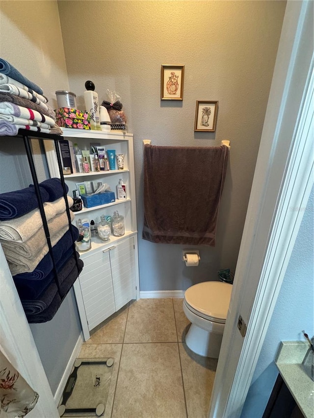 2289 Seven Oaks Dr, Saint Cloud, FL 34772 - bathroom featuring tile patterned floors, toilet, and baseboards