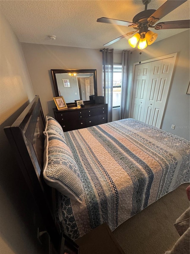 2289 Seven Oaks Dr, Saint Cloud, FL 34772 - bedroom with a ceiling fan and a textured ceiling