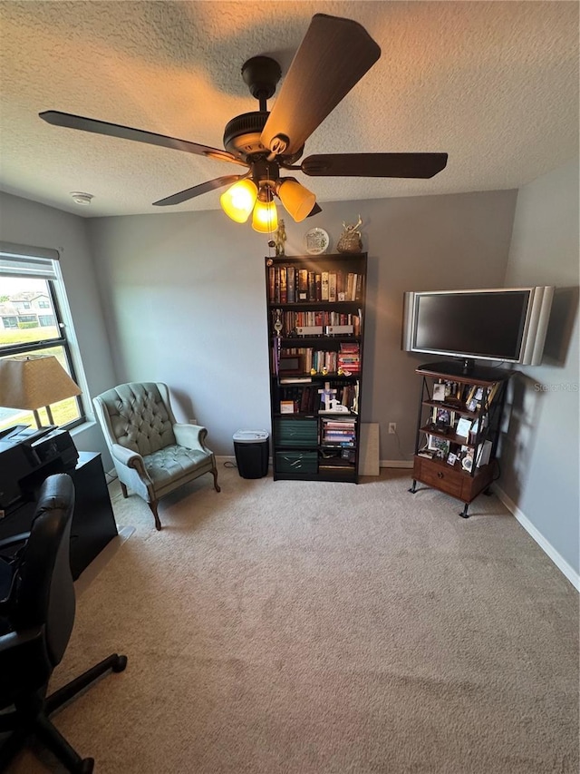 2289 Seven Oaks Dr, Saint Cloud, FL 34772 - home office with a textured ceiling, ceiling fan, carpet flooring, and baseboards
