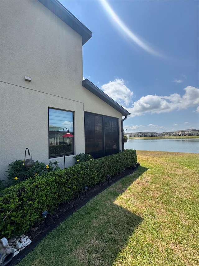 2289 Seven Oaks Dr, Saint Cloud, FL 34772 - view of green lawn with a water view