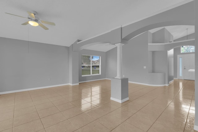 664 Eagle Pointe S, Kissimmee, FL 34746 - empty room featuring light tile patterned floors, healthy amount of natural light, a ceiling fan, decorative columns, and high vaulted ceiling