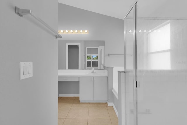664 Eagle Pointe S, Kissimmee, FL 34746 - full bath featuring vanity, a shower stall, tile patterned flooring, and baseboards