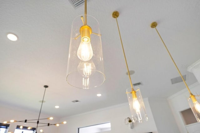 detailed view of crown molding and recessed lighting