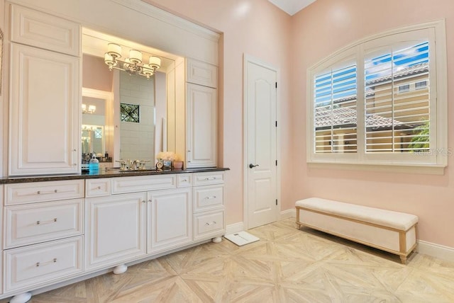 bathroom with baseboards and vanity