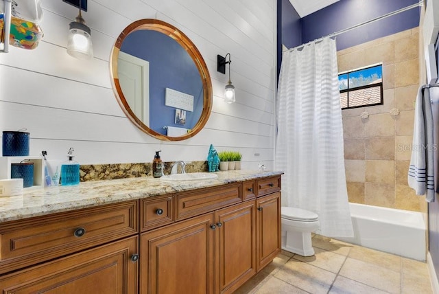 bathroom featuring tile patterned floors, vanity, toilet, and shower / bathtub combination with curtain