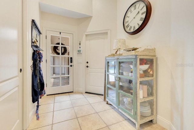 foyer featuring light tile patterned flooring