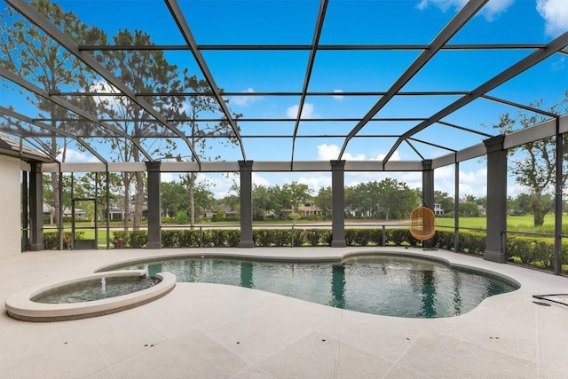 view of swimming pool featuring a lanai, a patio area, and a pool with connected hot tub
